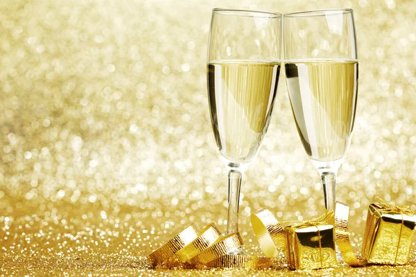 Champagne and gifts — Stock Photo, Image