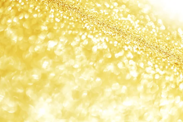 Golden festive glitter background with defocused lights — Stock Photo, Image