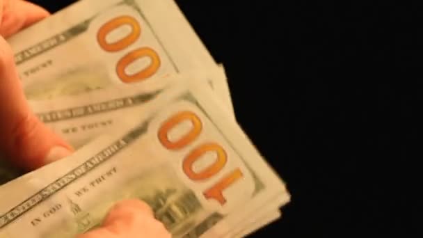 Hand count dollar bills on black — Stock Video