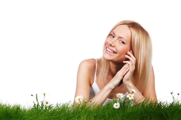 Woman on grass with flowers — Stock Photo, Image