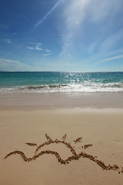 Sun drawing on a beach — Stock Photo, Image