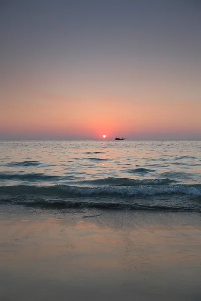 Fishing boat at sunset — Stock Photo, Image