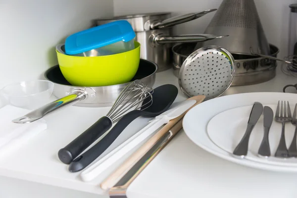 Various tableware on shelf in the kitchen — Stock Photo, Image