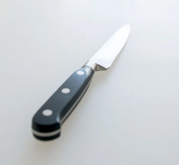 Cutting board and kitchen knife — Stock Photo, Image