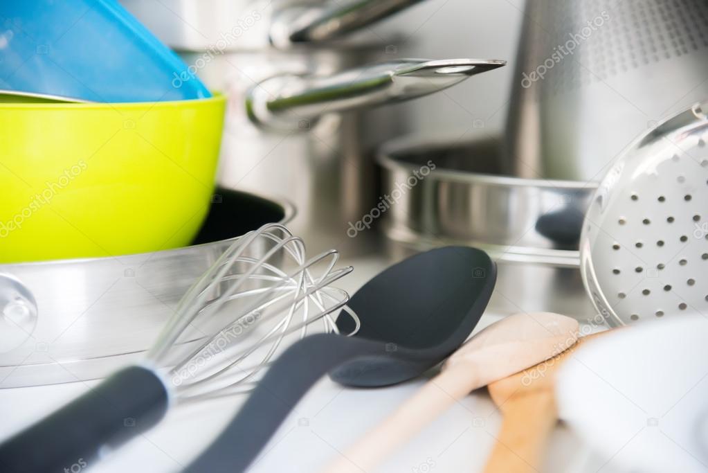 Various tableware on shelf in the kitchen