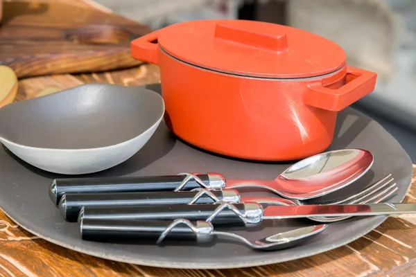 New modern cast iron cauldron and kitchen appliances — Stock Photo, Image