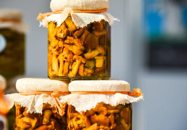 Marinated mushrooms in a glass jar — Stock Photo, Image