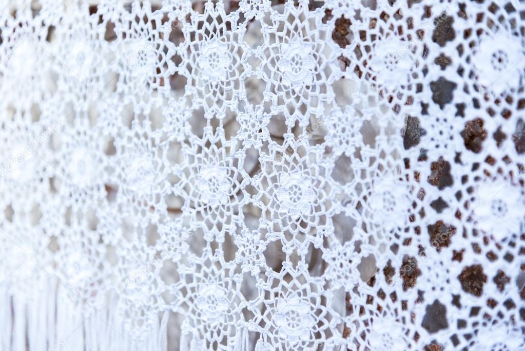 white woven lace patterned tablecloth