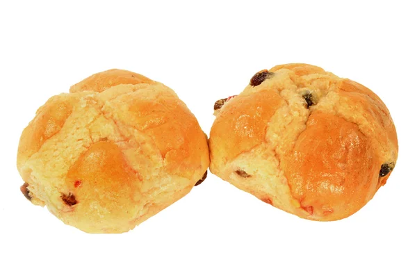 Две булочки с горячим крестом над белым — стоковое фото