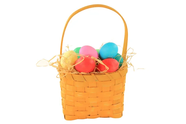 Easter dyed eggs in wooden square shaped basket — Stock Photo, Image