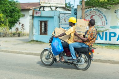 Motorcycle taxi in Benin clipart