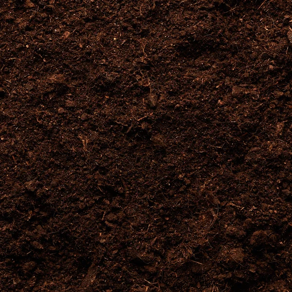 Чёрная текстура почвы — стоковое фото
