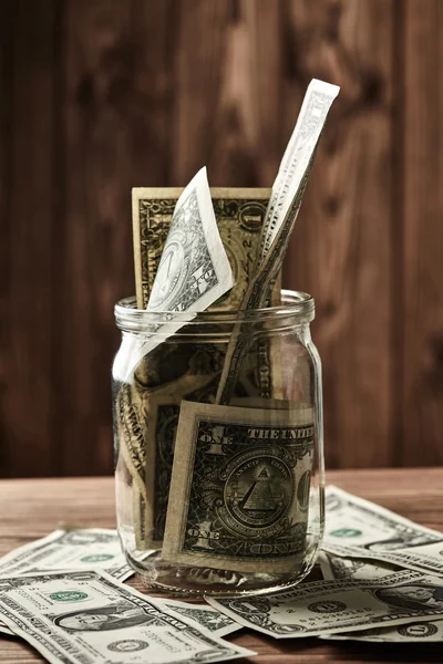 Dollar in glazen pot — Stockfoto