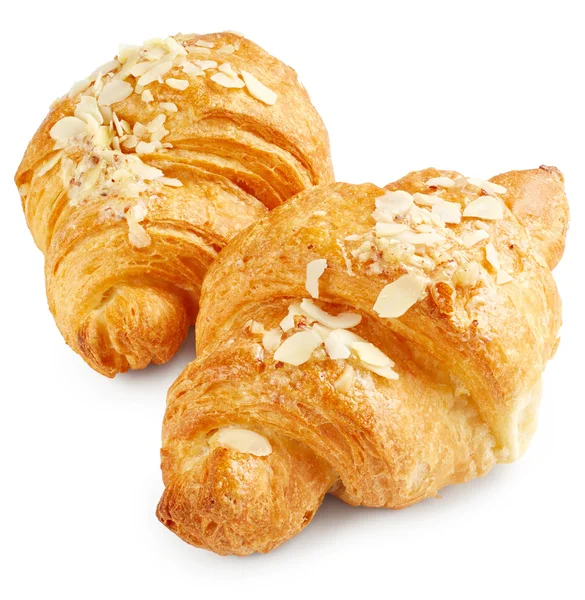 Čerstvé croissanty na bílém pozadí — Stock fotografie