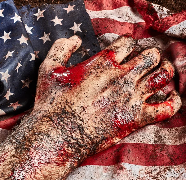 Mano humana en la bandera americana — Foto de Stock