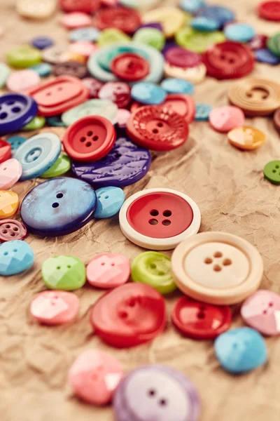 Buttons on paper background — Stock Photo, Image