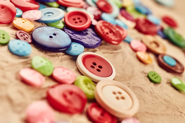 Buttons on paper background — Stock Photo, Image