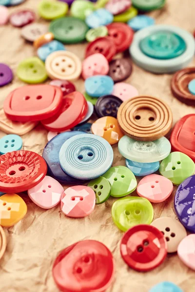 Buttons on beige paper — Stock Photo, Image