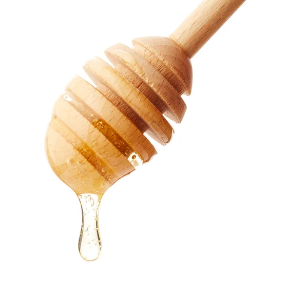 从亲爱的木瓢上滴下的蜂蜜 — 图库照片