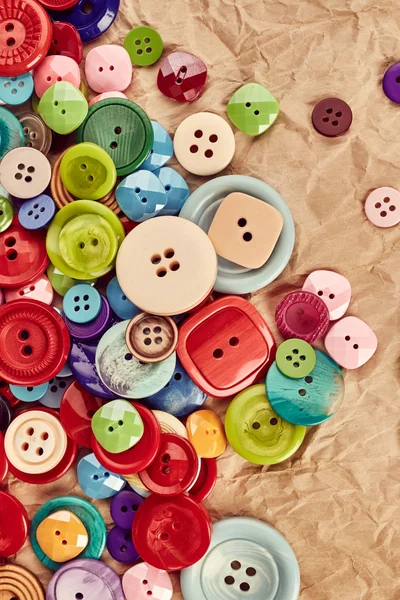 Buttons on paper background — Stock Photo, Image