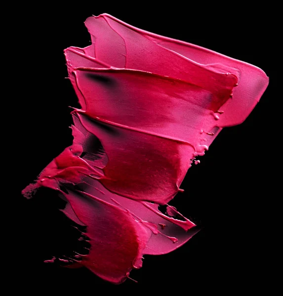 黒の背景に単離されたSmudged口紅 — ストック写真