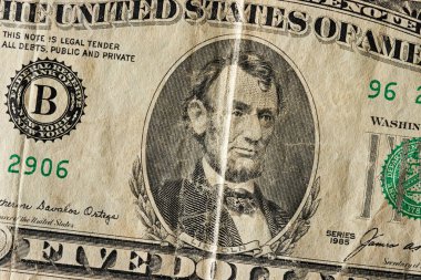 Finans konsepti. Makro vuruşlar Amerikan doları banknotunun yıllanmış hali.