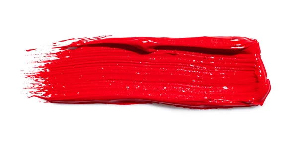 白い背景の上に赤い塗料のスミア — ストック写真