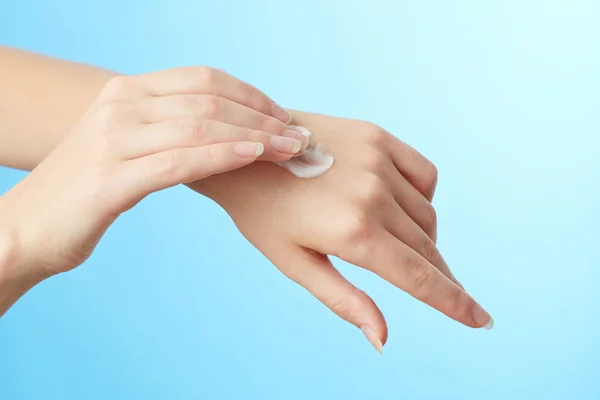 Woman's hands in moisturizer cream — Stock Photo, Image