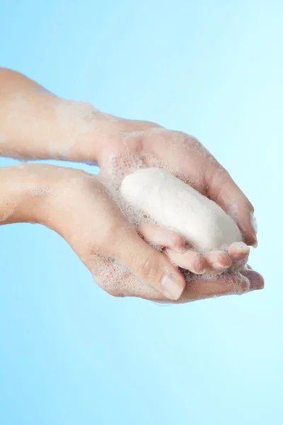 Woman's hands in foam of shower gel with soap — Stock Photo, Image