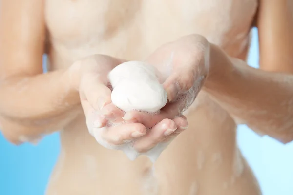 Woman in bathroom with soap — Stock Photo, Image