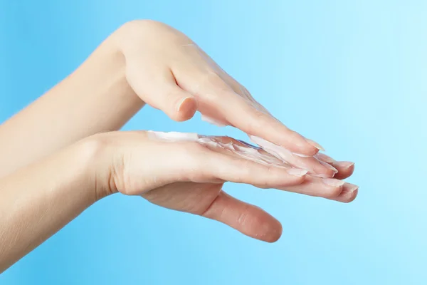 Woman's hands in moisturizer cream — Stock Photo, Image