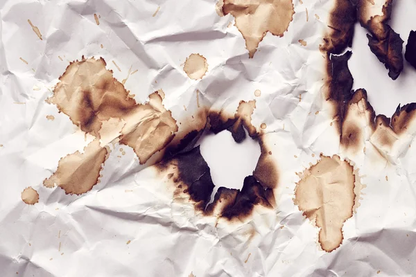 Burnt hole of paper — Stock Photo, Image