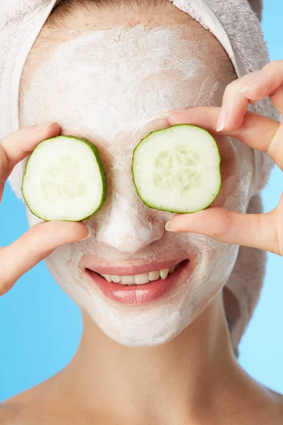 Young woman with facial mask — Stock Photo, Image