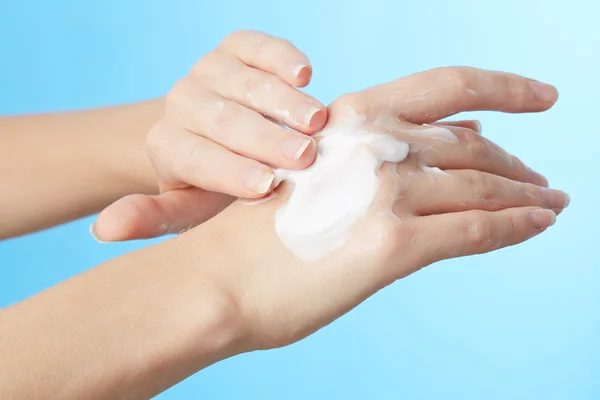 Woman's hands in moisturizer cream — Stock Photo, Image