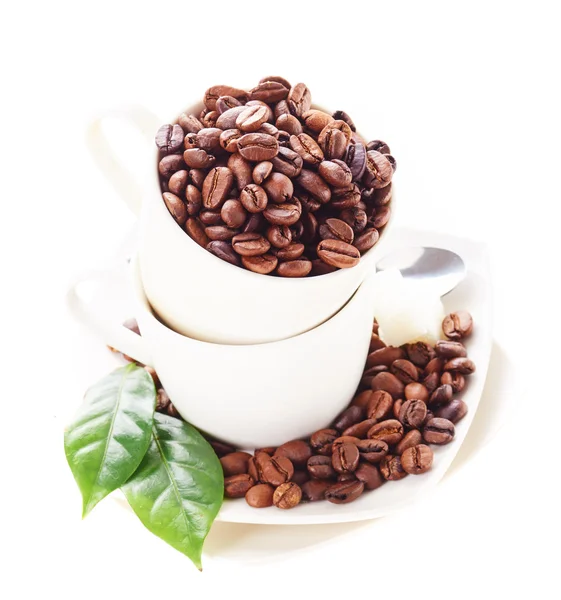Granos de café en taza —  Fotos de Stock