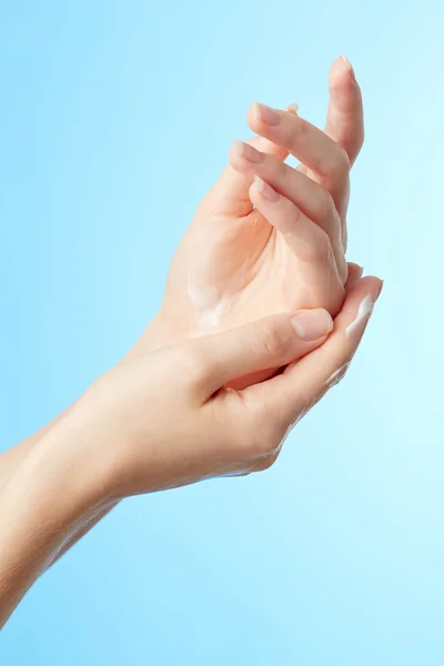 Woman's hands in moisturizer cream — Stock Photo, Image