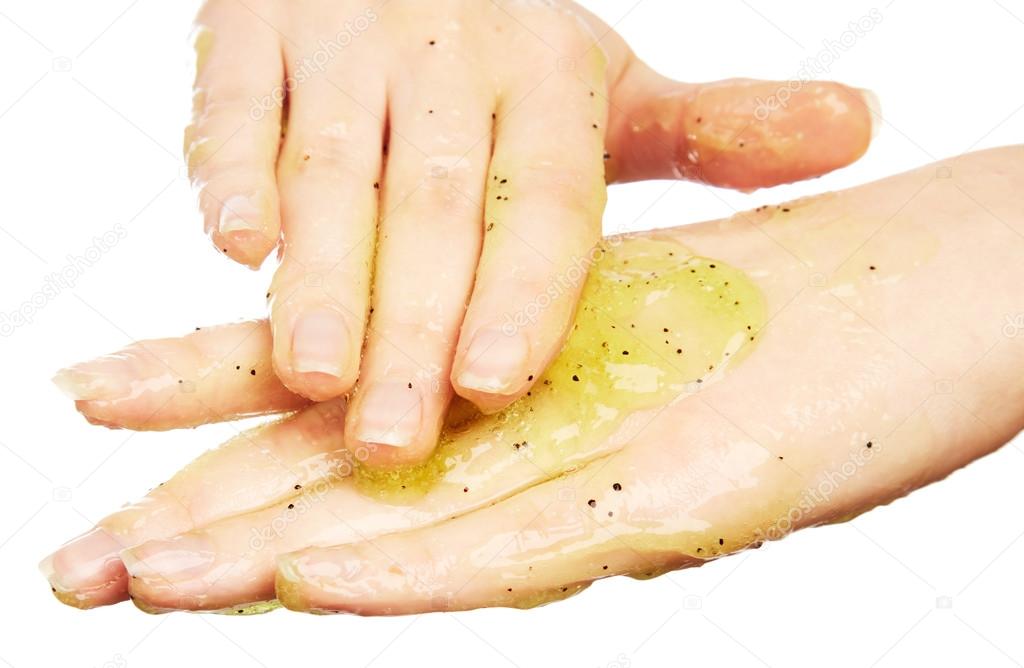 Woman's hands in body scrub