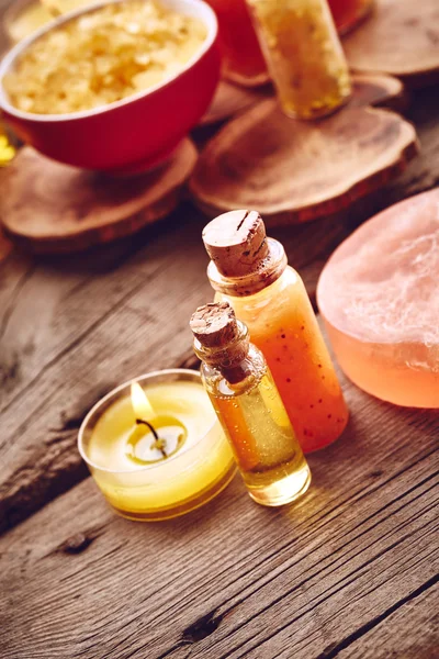 Bottles with oil and scrub for body — Stock Photo, Image