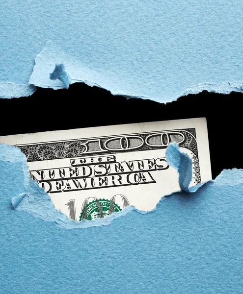 Torn blue paper and money — Stock Photo, Image