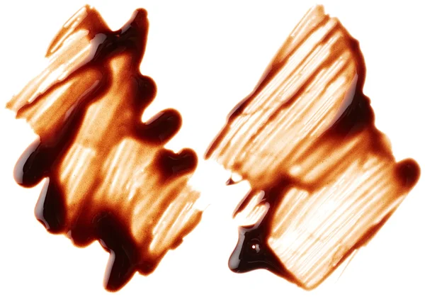 Beyaz zemin üzerine çikolata şurubu — Stok fotoğraf