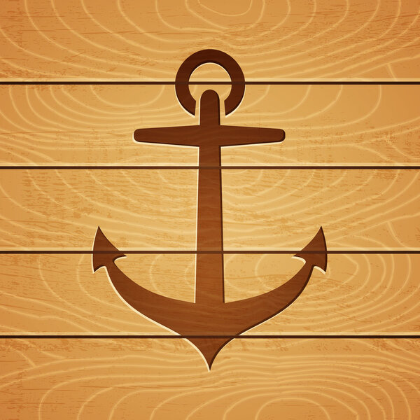 якорь на деревянном фоне

