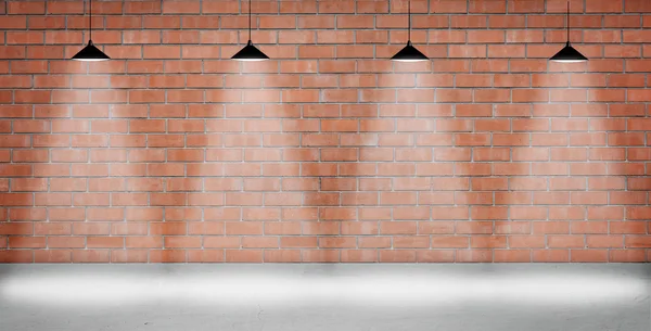 Brown brick wall lightened with four lamps — Stock Photo, Image