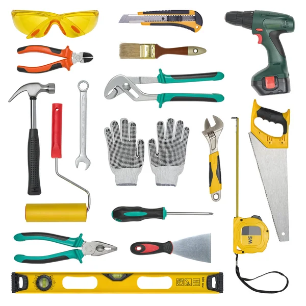 Set van hulpmiddelen van de bouw geïsoleerd op een witte achtergrond. Niveau, zagen, glazen, meetlint, moersleutel, spanner, verf roll, hamer, schaar, tangen. — Stockfoto