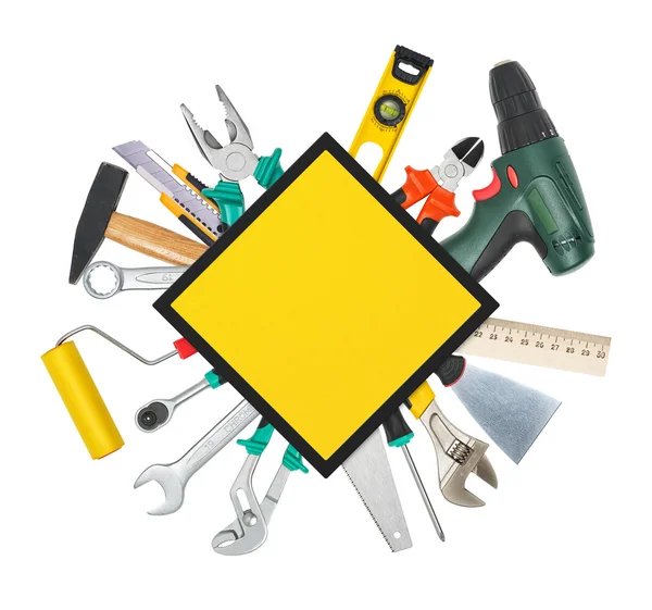 Conjunto de instrumentos y herramientas debajo del letrero de construcción — Foto de Stock