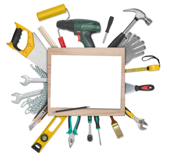 Set of instruments and tools underneath wooden desk with white blank paper. Copy space at center — 스톡 사진