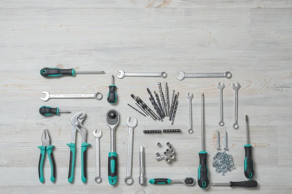 Top view of construction instruments and tools on wooden DIY workbench with copy space at top — Zdjęcie stockowe