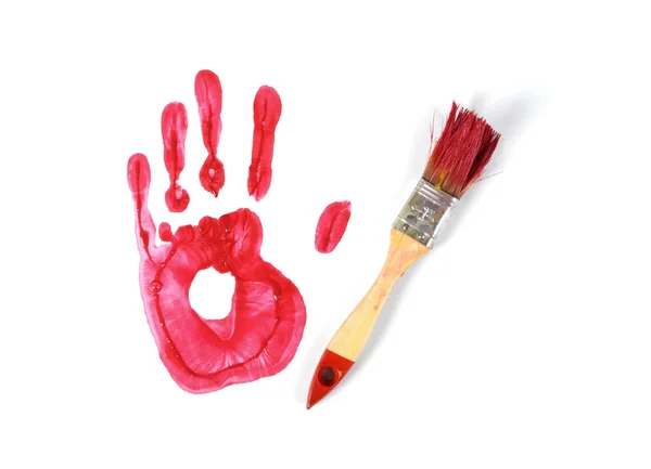 Paint brush and handprint — Stock Photo, Image