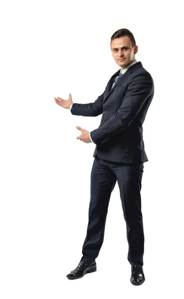 Επιχειρηματίας στέκεται δείχνοντας την κατεύθυνση από τα δύο χέρια. — Φωτογραφία Αρχείου