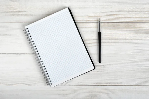 Top view of open empty notebook and black pen. — Stock Photo, Image