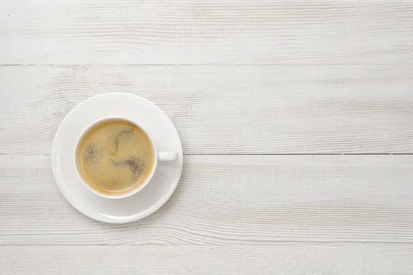 Kopje koffie op een schotel. — Stockfoto